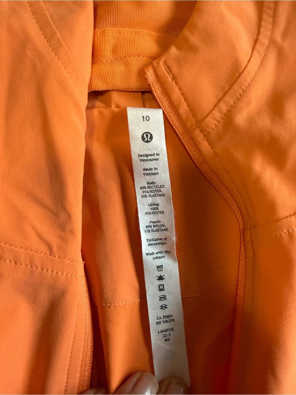 Lululemon hooded wind/rain jacket. Worn once, beautiful orange/peach color.